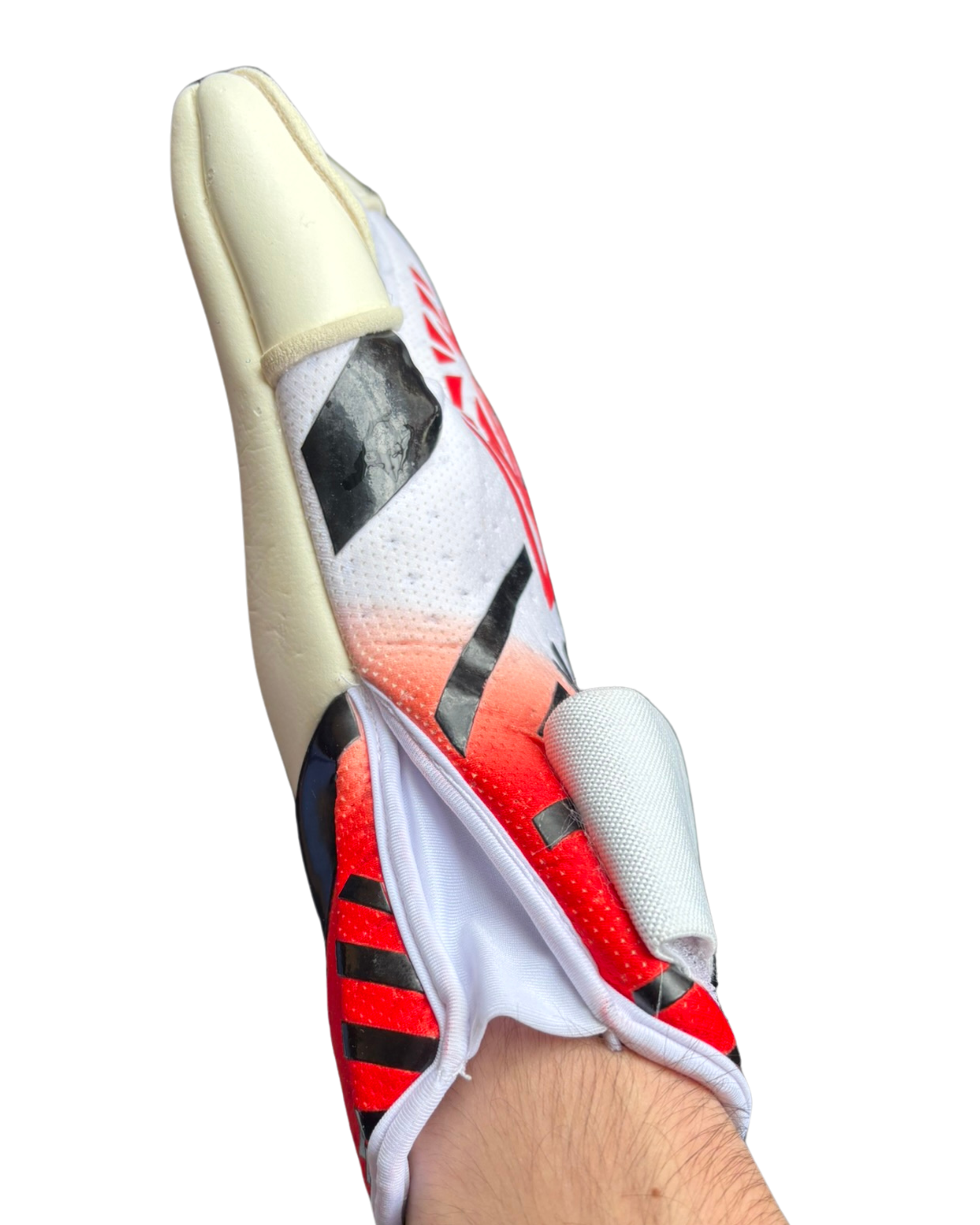 Close-up of a sports shoe with red and black design on a white background